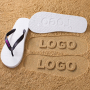 Black or White Flip-Flops with an Engraved Sole Logo
