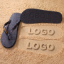 Black or White Flip-Flops with an Engraved Sole Logo