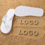 Black or White Flip-Flops with an Engraved Sole Logo